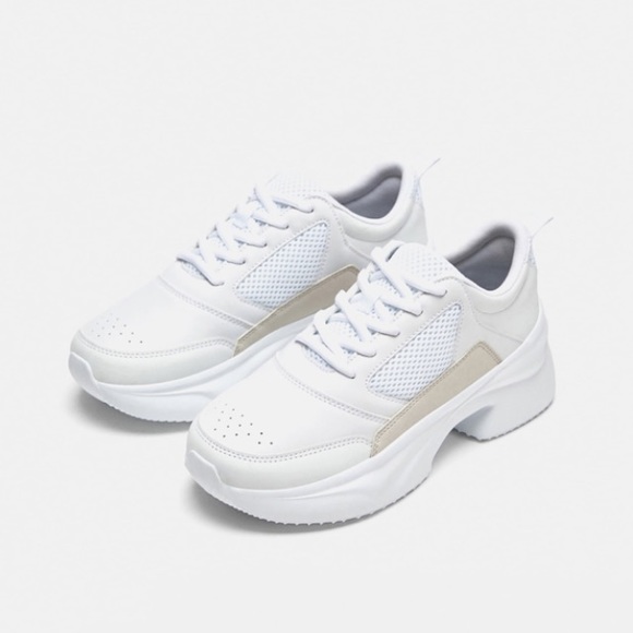 white thick soled tennis shoes